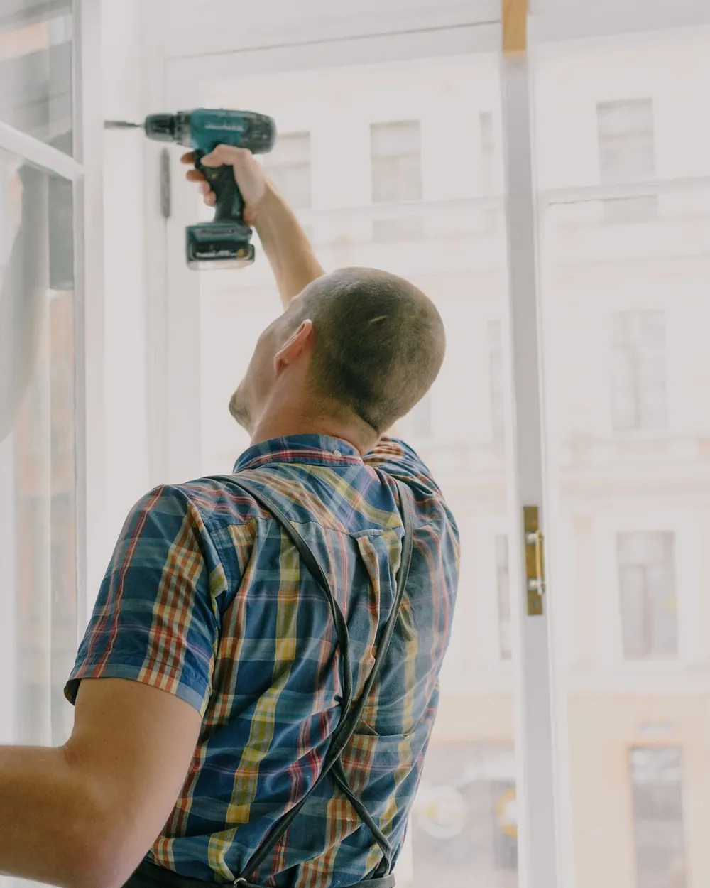 Builder at work on a house