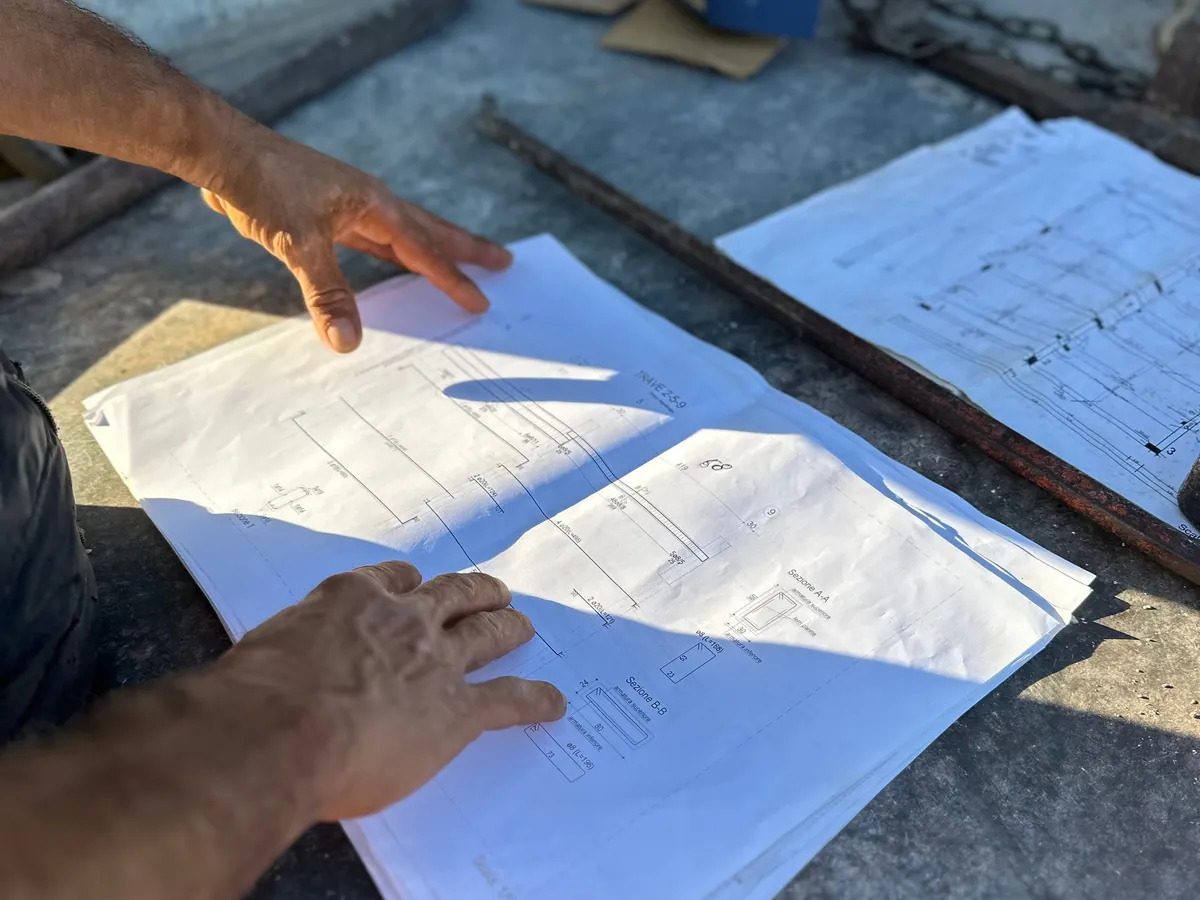 Plans spread out on a table on site