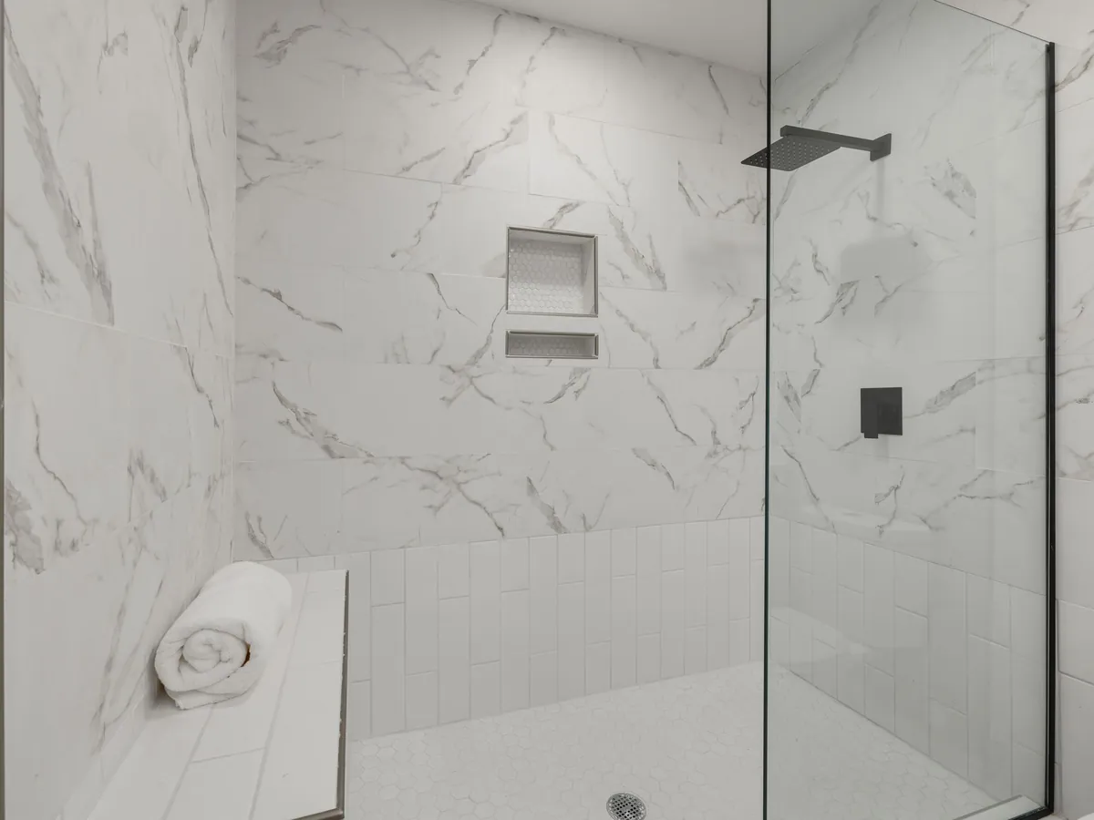 Walk-in shower in a tiled wet room