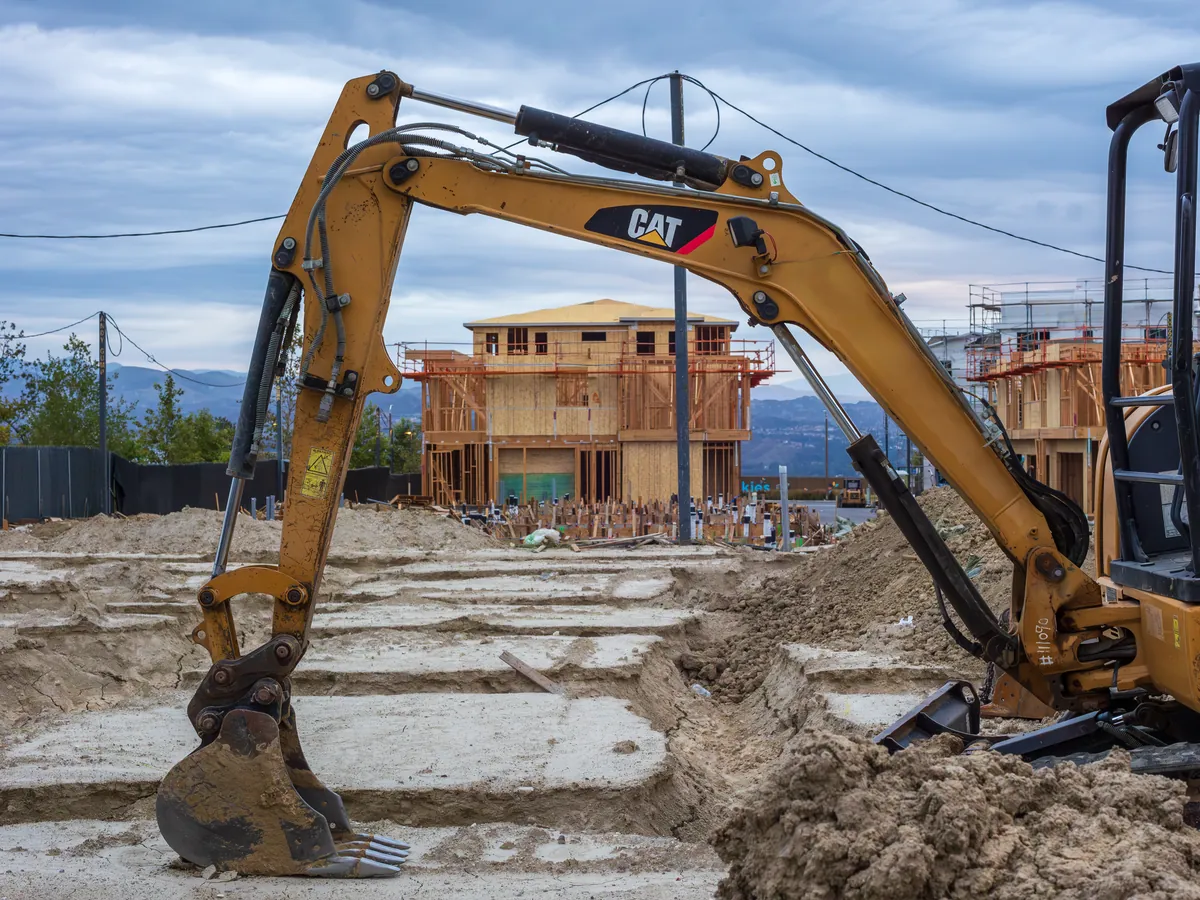 Excavator digging a foundation trench